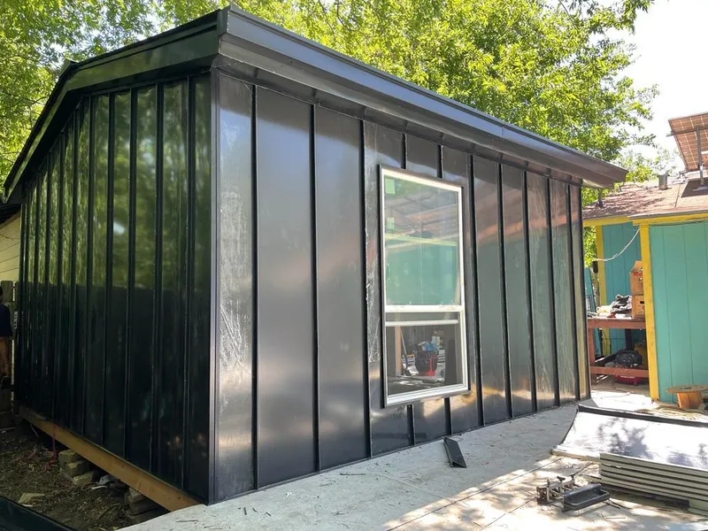 Black standing seam metal wall panels for Roof Inspection in Erwin